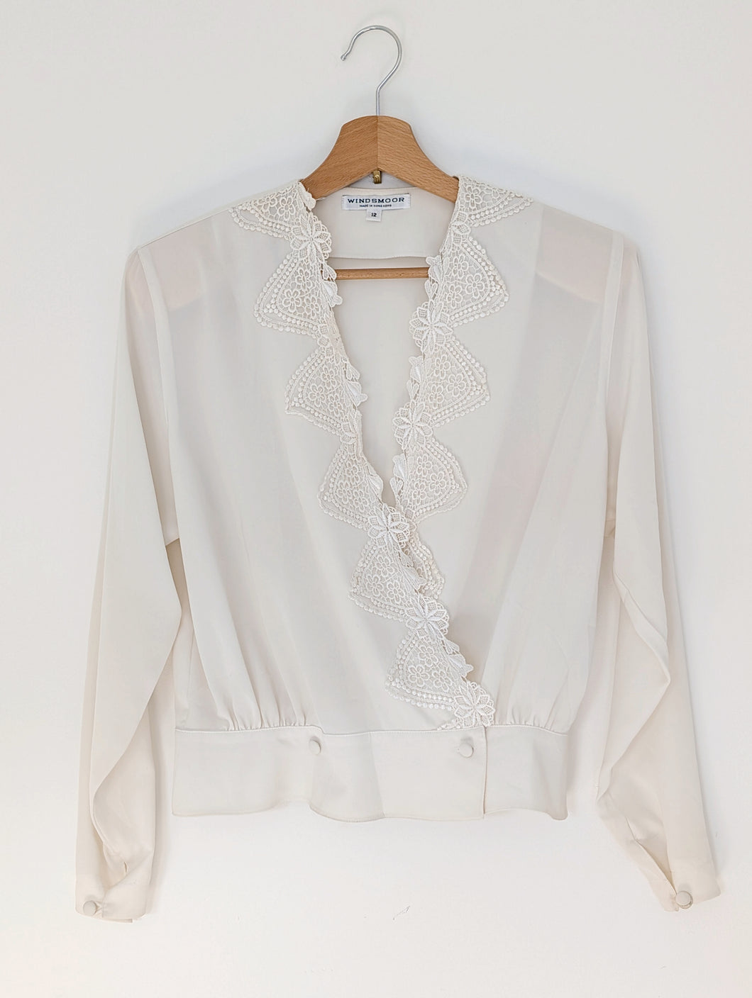 White Wrapover Bouse with Florals.
Size 12